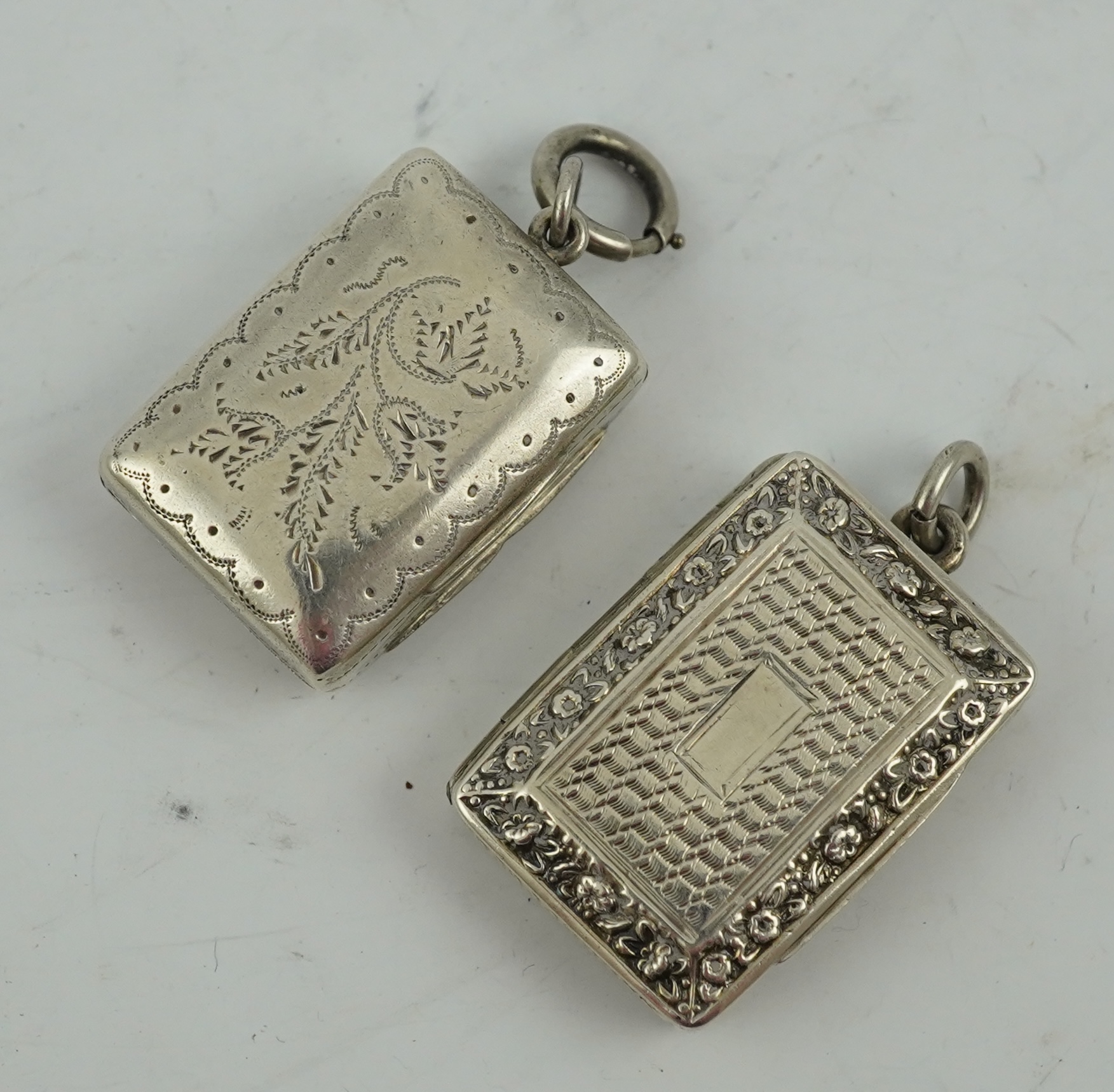 A George IV engraved and embossed silver rectangular vinaigrette by John Bettridge, Birmingham, circa. 1825, 32mm and a William IV vinaigrette by Thomas Simpson Jn. Birmingham, 1836.